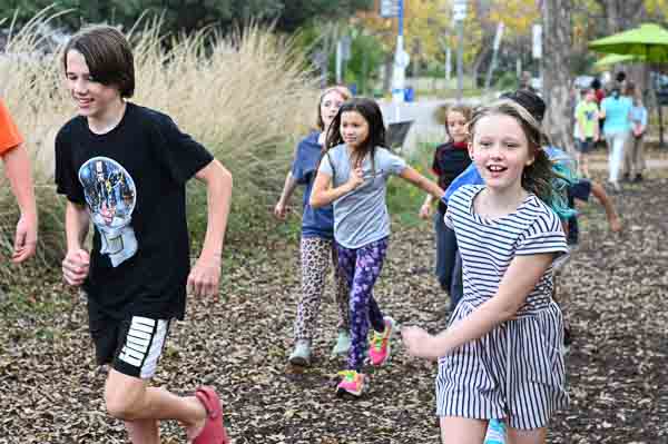 Kids at non-religious private school run outdoors after lunch.