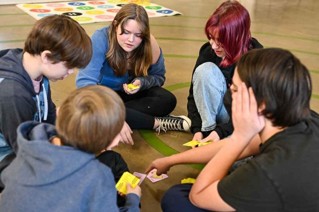 Private middle school students play game to develop social emotional learning.