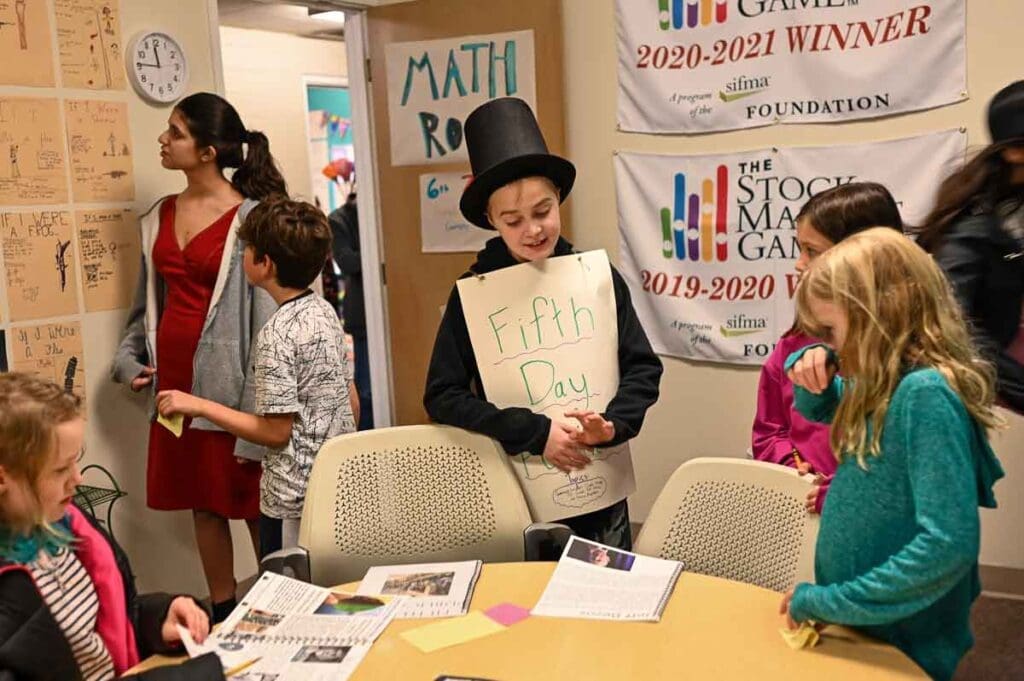 Seventh grader at progressive school dresses up and explains fifth day to other kids.